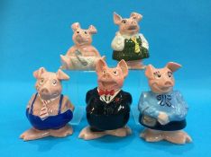 A set of five Nat West pigs