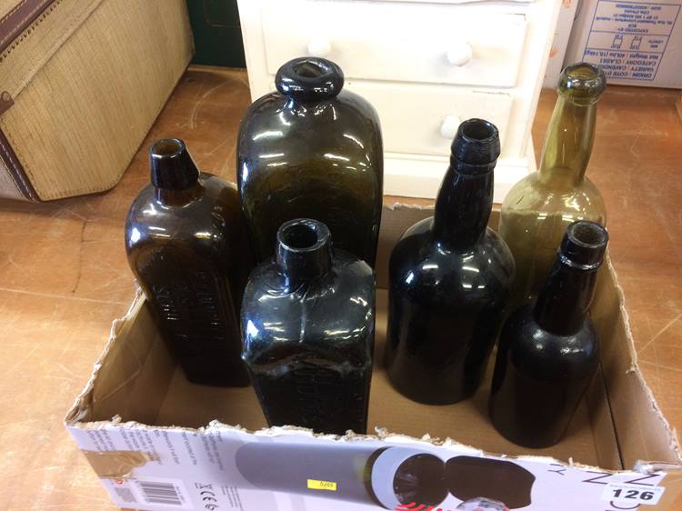 Three Antique glass bottles and three Continental bottles; 'J. T. Beukers' Schiedam', 'V. Hoytema