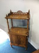 An inlaid Victorian walnut what not