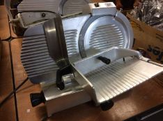 A Derek White meat slicer