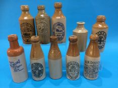 Ten stoneware advertising bottles