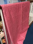 A pink and floral reverse Durham quilt