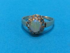 An unmarked diamond and opal ring, size 'O', 3.1 grams