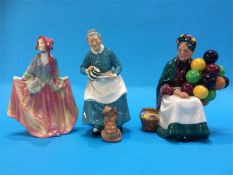 Three Royal Doulton figures 'Sweet Anne' HN 1330 ,'The Old Balloon Seller' HN 1315 and 'The