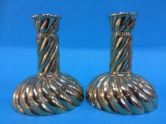 A small pair of brass candlesticks