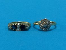 A diamond and sapphire ring and a diamond cluster ring, marks rubbed