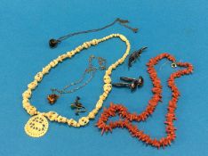 A coral necklace, silver brooch etc.