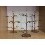 Three metal wine glass stands