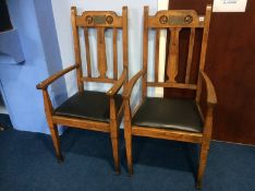 A pair of oak carver chairs, with brass presentation plaques