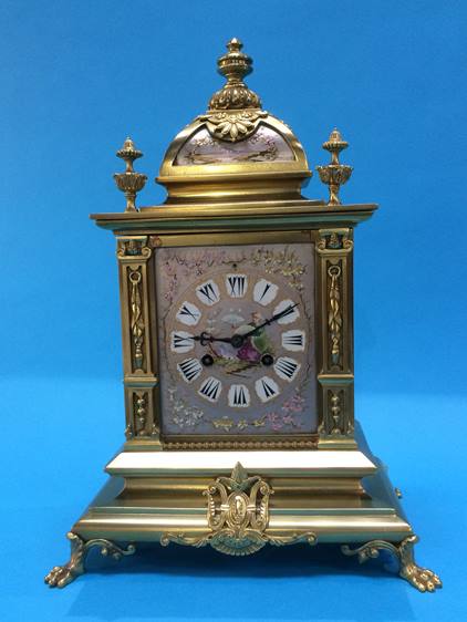 An early 20th century French brass mantel clock with 8 day movement, strike action, silvered dial,