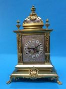 An early 20th century French brass mantel clock with 8 day movement, strike action, silvered dial,