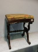 A Victorian rosewood footstool