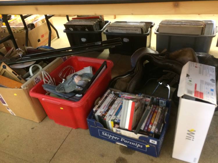Three boxes of miscellaneous, including DVDs, saddle and Wii