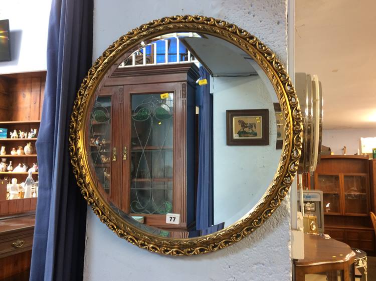 A gilt circular mirror