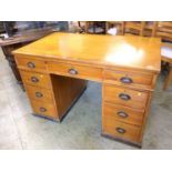 A pine pedestal desk