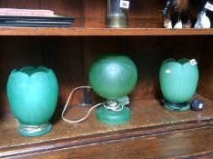 Pair of pressed glass lamps and one other