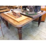 A Victorian mahogany extending dining table