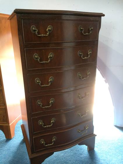 Walnut bow front chest of drawers