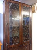 Oak leaded glass and linenfold bookcase