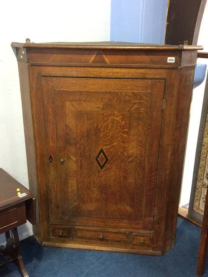 An oak corner cabinet