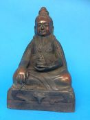 A bronze model of a seated Buddha, 29cm high