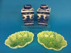 A pair of Ringtons blue and white caddies and a pair of yellow Pearline bowls