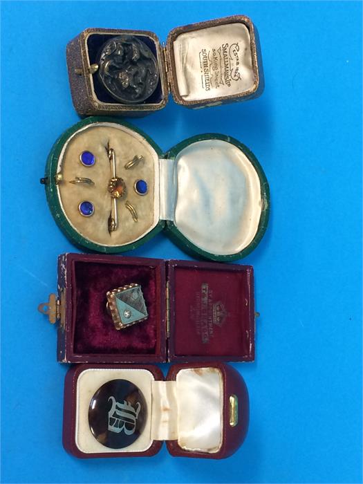 Three various solitaires and a set of three shirt studs and brooch