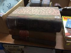 Three leather bound ledgers