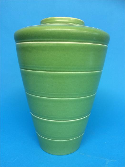 A Keith Murray vase with pale green ground of tapering form with concentric rings on matt green,