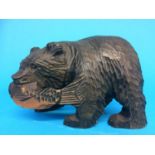 A carved wood bear