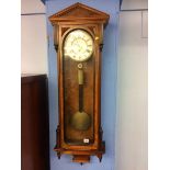 A walnut single weight wall clock