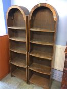 A pair of narrow oak bookcases