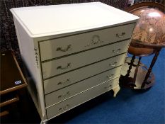 A cream bow front chest of five drawers