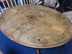 A Victorian walnut and marquetry inlaid oval loo table