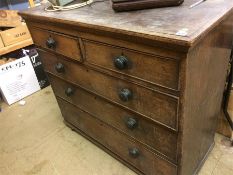 A Georgian oak straight front chest of two short and three long drawers