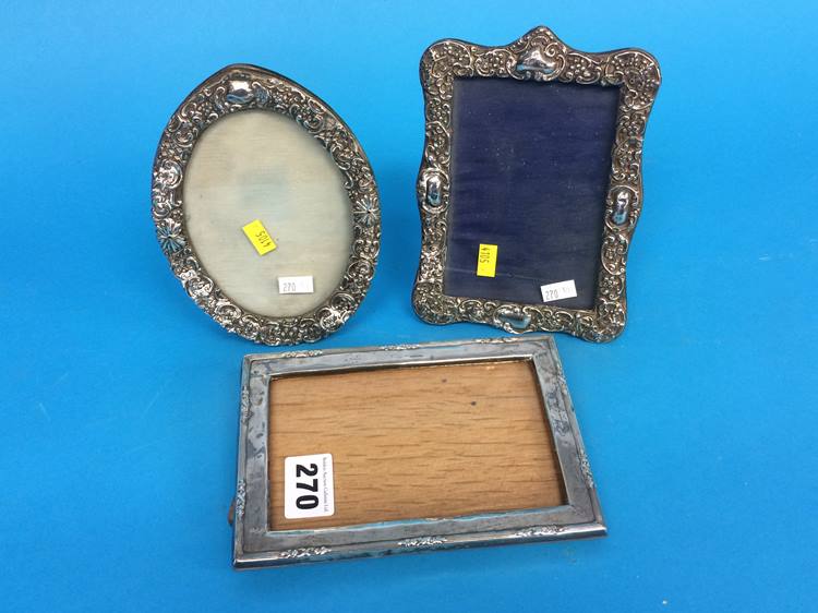 Three silver picture frames