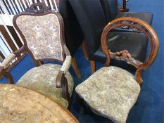 Three walnut dining chairs and a French style armchair