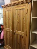 A pine double door wardrobe