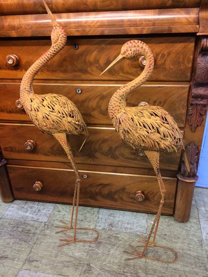 A pair of metal work storks