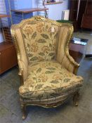 A large gilt framed French style armchair