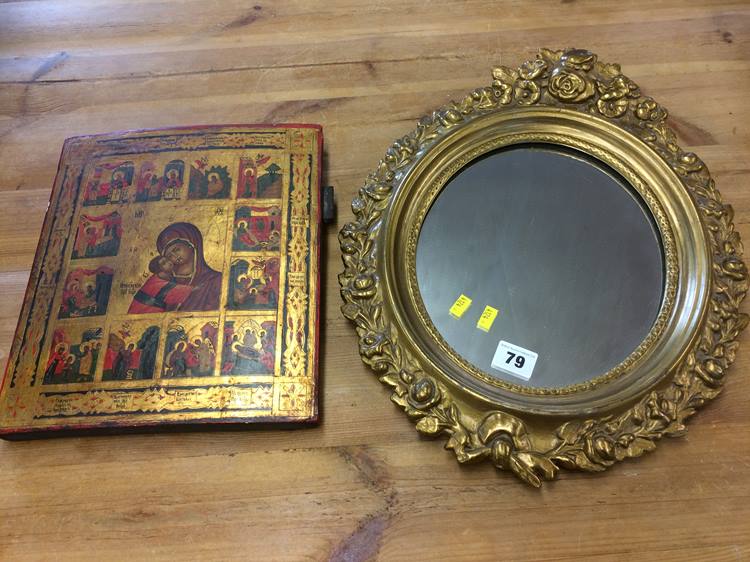 A small icon and a gilt oval mirror