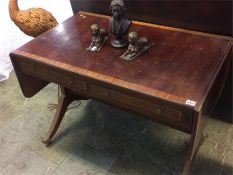 A mahogany two drawer sofa table