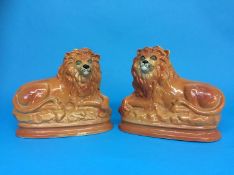 A pair of Staffordshire lions