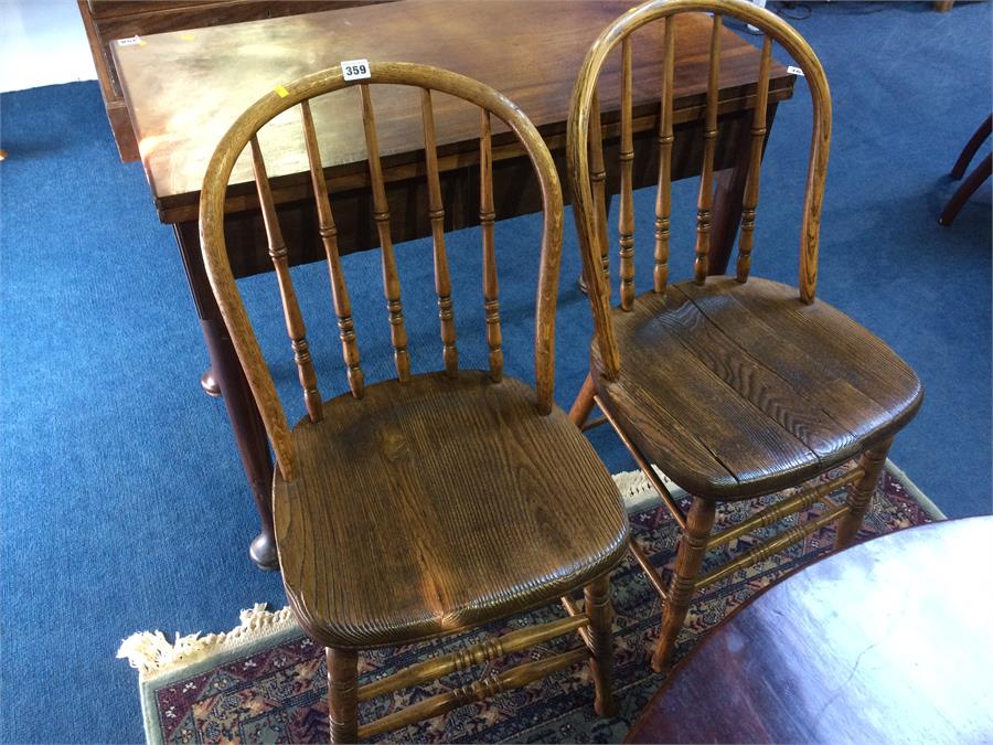 A pair of stick back chairs