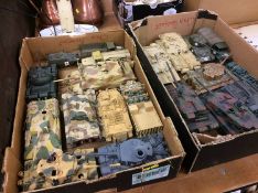 Two trays of model tanks