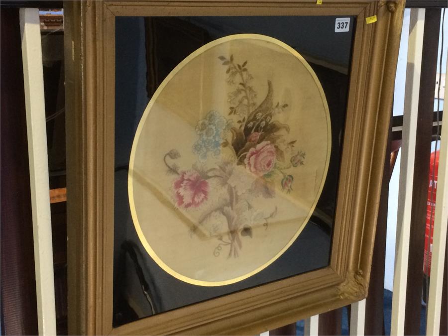 A late 19th century circular floral needlework