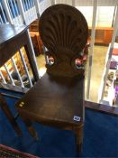 A Victorian oak hall chair