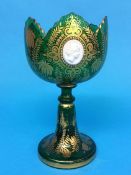 A 19th century Bohemian green glass goblet with foliate gilt decoration and three applied cameos,