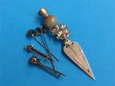 Two Scottish silver agate set brooches, a thistle paper clip and two tie pins (5)