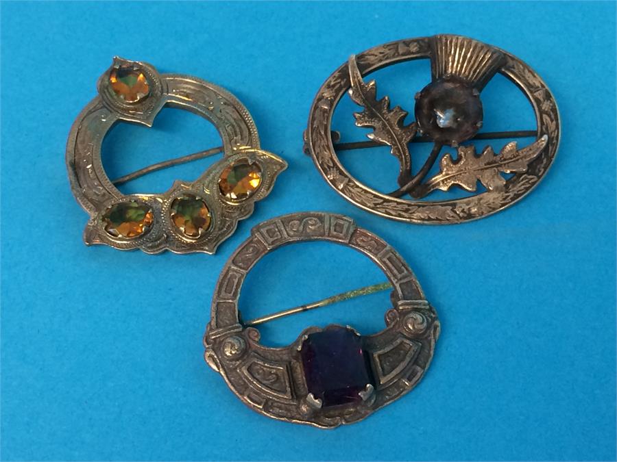 A silver Scottish brooch, a sterling silver Scottish brooch and another Scottish design brooch (3) - Image 2 of 2